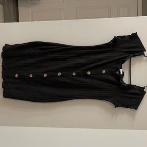 Black fitted dress with accented buttons